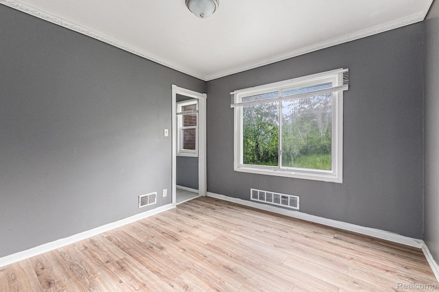 15817 Cheyenne St, Detroit, MI 48227 - unfurnished room with ornamental molding, baseboards, and light wood-type flooring