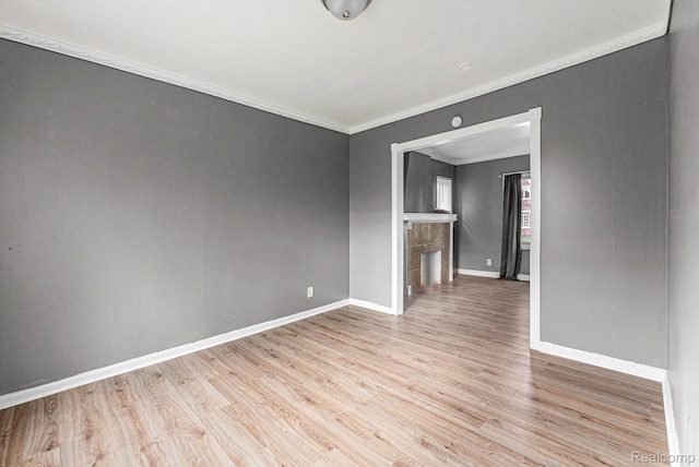 15817 Cheyenne St, Detroit, MI 48227 - unfurnished room with crown molding, baseboards, and light wood-style floors