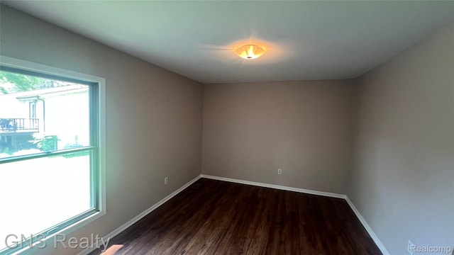 604 Millard Ave, Royal Oak, MI 48073 - spare room with dark wood finished floors and baseboards