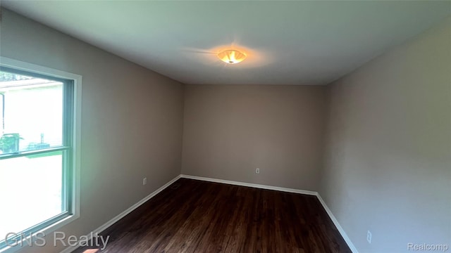 604 Millard Ave, Royal Oak, MI 48073 - empty room with dark wood-style floors and baseboards
