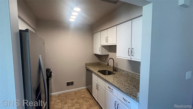 604 Millard Ave, Royal Oak, MI 48073 - kitchen with a sink, stainless steel appliances, stone countertops, and white cabinets
