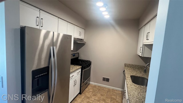 604 Millard Ave, Royal Oak, MI 48073 - kitchen featuring stainless steel appliances, a sink, under cabinet range hood, white cabinets, and light stone counters