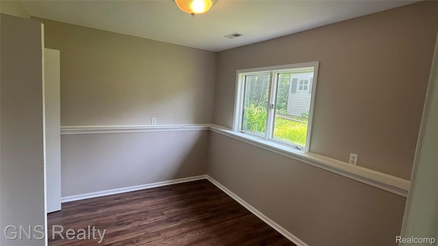 604 Millard Ave, Royal Oak, MI 48073 - spare room with dark wood-style floors and baseboards