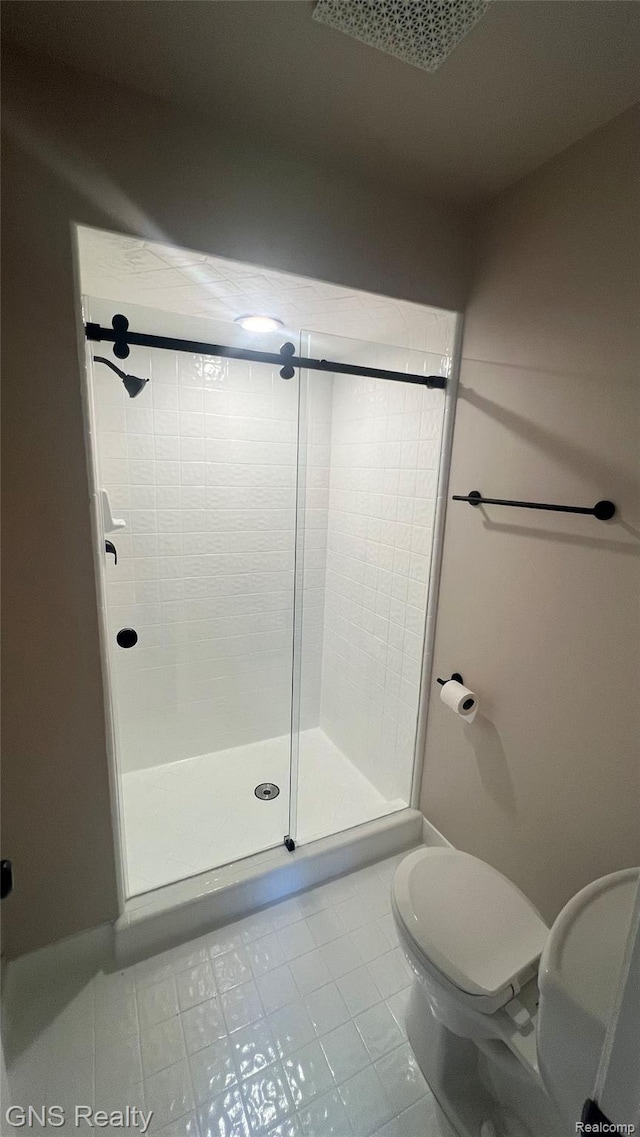 604 Millard Ave, Royal Oak, MI 48073 - full bath with a shower stall, tile patterned flooring, and toilet