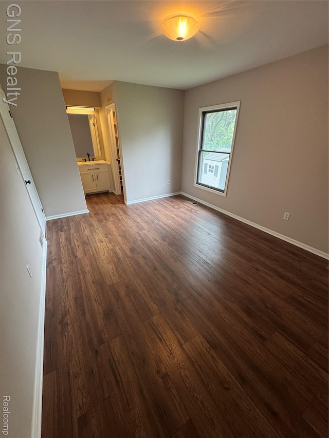604 Millard Ave, Royal Oak, MI 48073 - empty room featuring dark wood-style flooring and baseboards