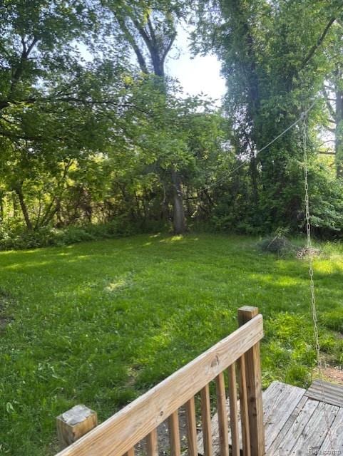 3231 Parker St, Port Huron, MI 48060 - view of grassy yard featuring a wooden deck