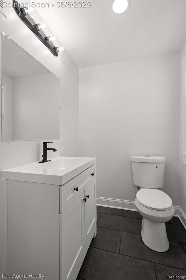 1703 N Blair Ave, Royal Oak, MI 48067 - half bath with vanity, toilet, tile patterned flooring, and baseboards