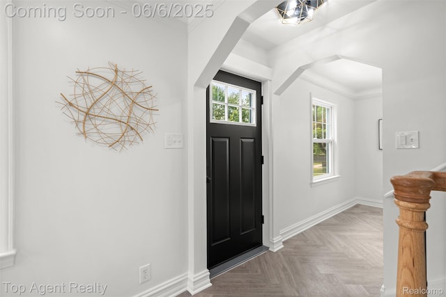 1703 N Blair Ave, Royal Oak, MI 48067 - foyer featuring baseboards, ornamental molding, and arched walkways