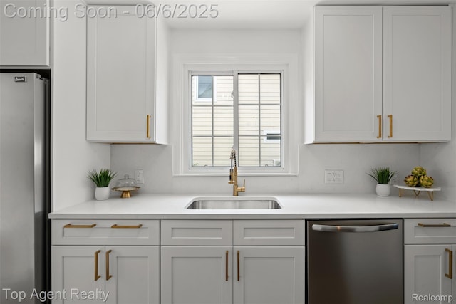 1703 N Blair Ave, Royal Oak, MI 48067 - kitchen featuring appliances with stainless steel finishes, a sink, light countertops, and white cabinets