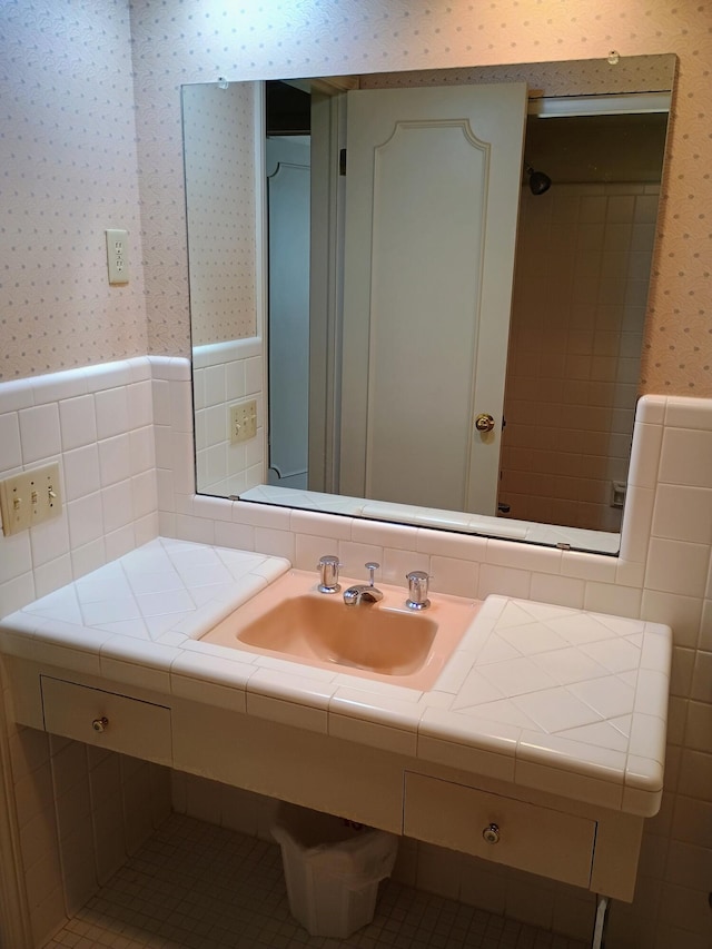 1635 Woodside Dr, East Lansing, MI 48823 - bathroom with wallpapered walls, vanity, a wainscoted wall, and tile walls