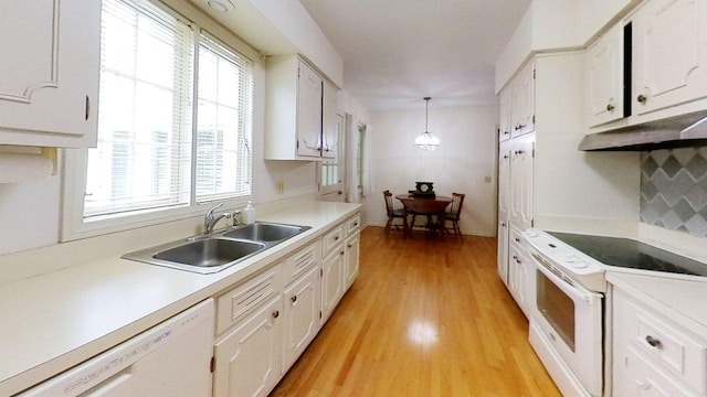 1635 Woodside Dr, East Lansing, MI 48823 - kitchen with a sink, white appliances, white cabinets, light wood-style flooring, and light countertops