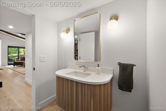 4340 Charing Cross Rd, Bloomfield Hills, MI 48304 - bathroom with wood finished floors, vanity, and baseboards