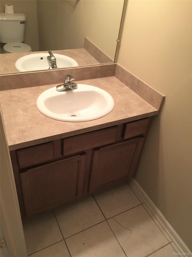 49225 W Woods Dr Unit 20, Utica, MI 48317 - half bathroom with vanity and tile patterned flooring