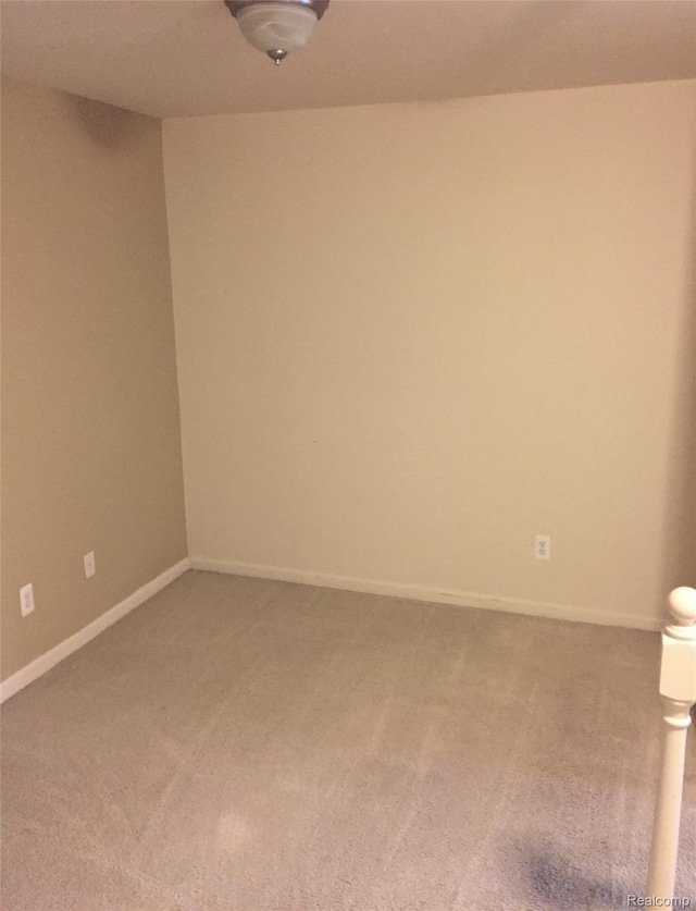 49225 W Woods Dr Unit 20, Utica, MI 48317 - unfurnished room featuring carpet floors and baseboards