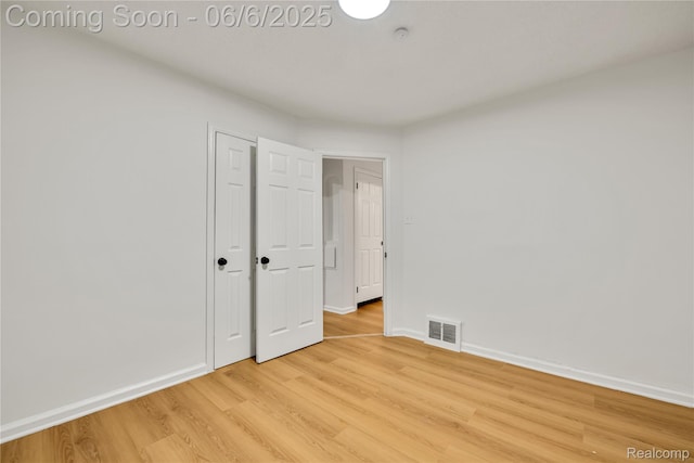 9248 Manor St, Detroit, MI 48204 - unfurnished bedroom featuring light wood-type flooring, baseboards, and a closet