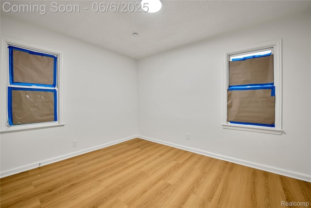 9248 Manor St, Detroit, MI 48204 - unfurnished room featuring wood finished floors and baseboards