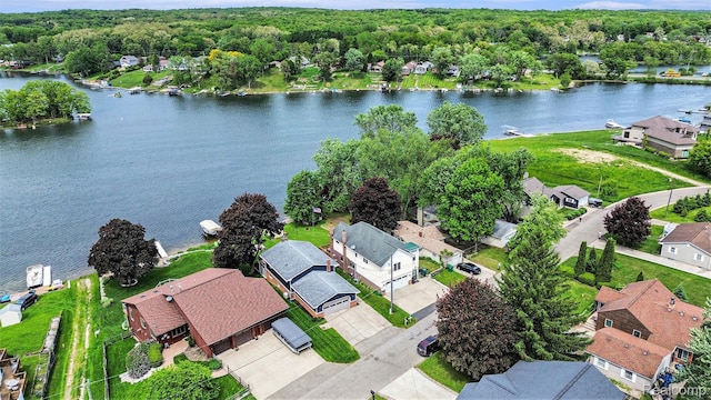 10048 King Rd, Davisburg, MI 48350 - aerial perspective of suburban area with a nearby body of water and a forest