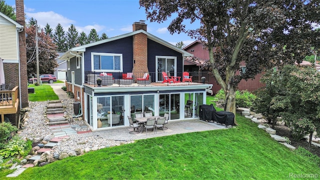 10048 King Rd, Davisburg, MI 48350 - back of property with a chimney, a patio, and a lawn