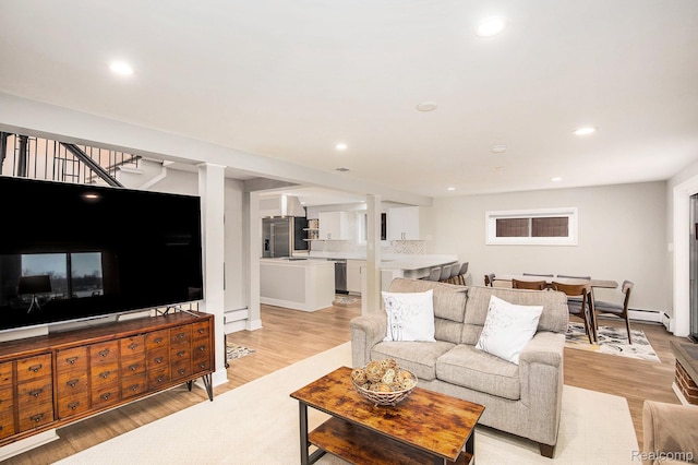10048 King Rd, Davisburg, MI 48350 - living area with light wood-style flooring, recessed lighting, and stairway