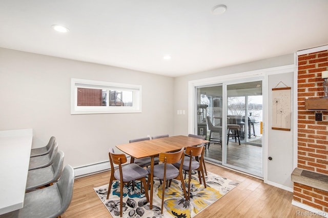 10048 King Rd, Davisburg, MI 48350 - dining area with healthy amount of natural light, light wood-type flooring, baseboard heating, baseboards, and recessed lighting