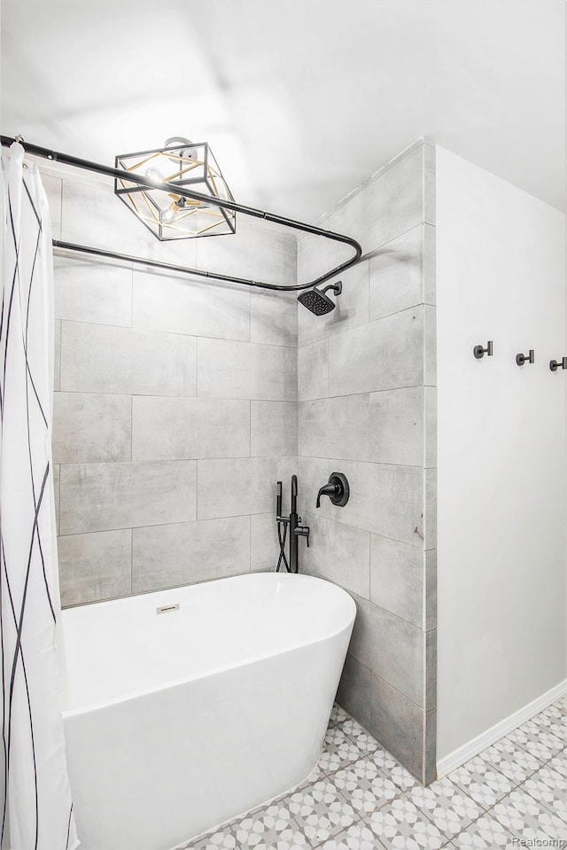 10048 King Rd, Davisburg, MI 48350 - full bath featuring a freestanding tub, tiled shower, and baseboards