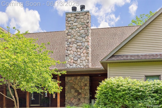 4230 Mill Lake Rd, Lake Orion, MI 48360 - exterior view of a shingled roof, a chimney, and gutters