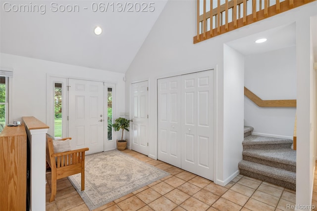 4230 Mill Lake Rd, Lake Orion, MI 48360 - entrance foyer featuring high vaulted ceiling, stairs, light tile patterned floors, and recessed lighting