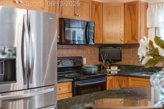 4230 Mill Lake Rd, Lake Orion, MI 48360 - kitchen featuring black appliances, tasteful backsplash, brown cabinetry, and dark stone countertops