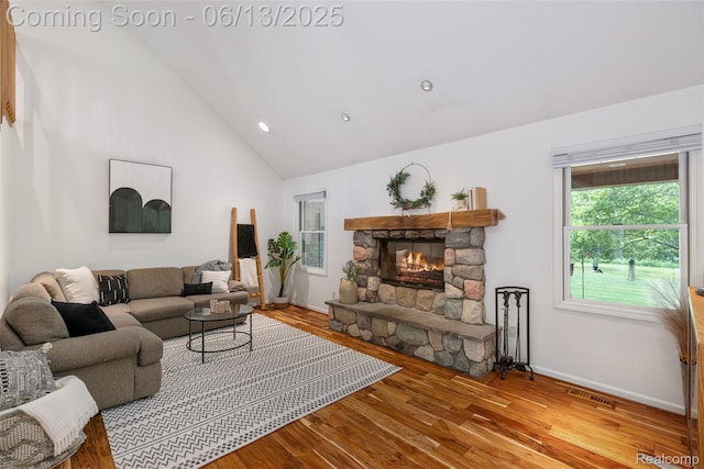 4230 Mill Lake Rd, Lake Orion, MI 48360 - living room with a stone fireplace, wood finished floors, recessed lighting, and high vaulted ceiling