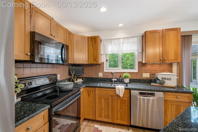 4230 Mill Lake Rd, Lake Orion, MI 48360 - kitchen with black appliances, backsplash, dark stone counters, brown cabinetry, and recessed lighting
