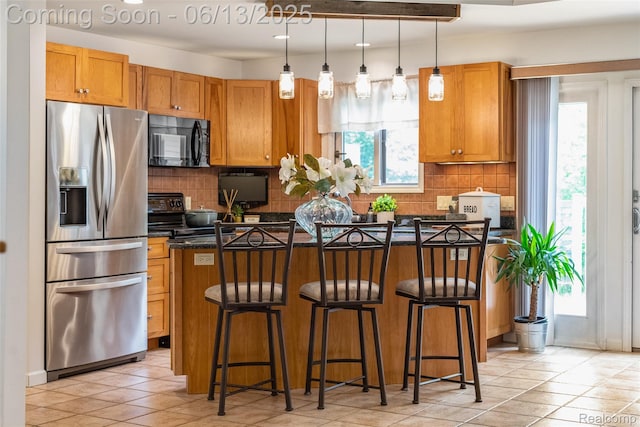 4230 Mill Lake Rd, Lake Orion, MI 48360 - kitchen featuring black appliances, light tile patterned floors, backsplash, brown cabinets, and recessed lighting