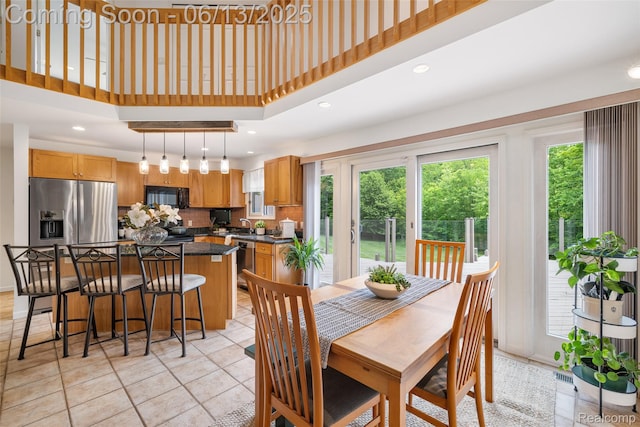 4230 Mill Lake Rd, Lake Orion, MI 48360 - dining space with light tile patterned floors, a towering ceiling, and recessed lighting