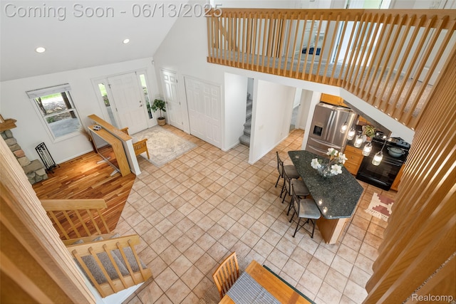 4230 Mill Lake Rd, Lake Orion, MI 48360 - living room with stairway, high vaulted ceiling, and recessed lighting