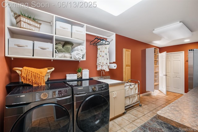 4230 Mill Lake Rd, Lake Orion, MI 48360 - laundry room with cabinet space, independent washer and dryer, and light tile patterned floors