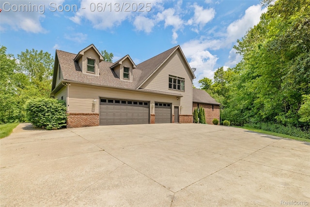 4230 Mill Lake Rd, Lake Orion, MI 48360 - view of front facade featuring brick siding, driveway, an attached garage, and a shingled roof