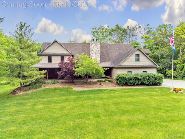 4230 Mill Lake Rd, Lake Orion, MI 48360 - view of front of home featuring a front lawn and a chimney