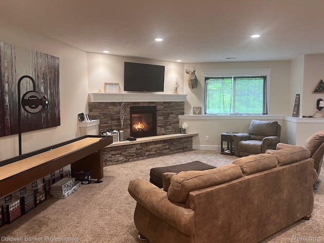 4264 W Benjamin Rd, Perry, MI 48872 - living room featuring carpet, a stone fireplace, and recessed lighting