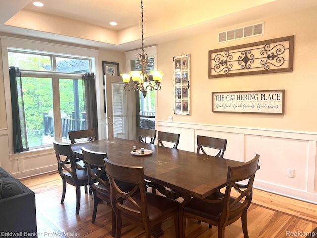 4264 W Benjamin Rd, Perry, MI 48872 - dining area with a raised ceiling, light wood finished floors, healthy amount of natural light, a chandelier, and recessed lighting