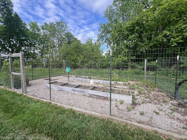 4264 W Benjamin Rd, Perry, MI 48872 - surrounding community with a vegetable garden