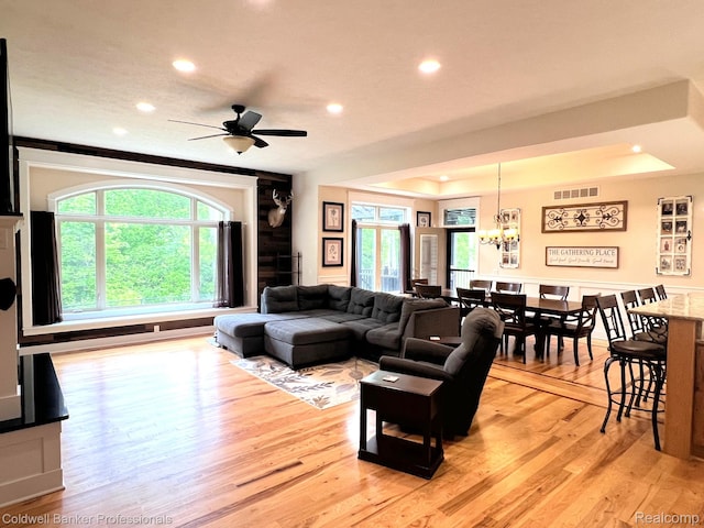4264 W Benjamin Rd, Perry, MI 48872 - living room featuring light wood-style floors, recessed lighting, a ceiling fan, a chandelier, and a raised ceiling