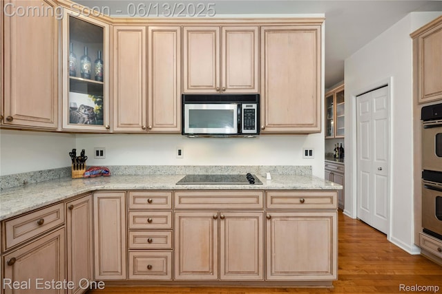 3788 High Grove Way, Lake Orion, MI 48360 - kitchen with stainless steel appliances, light brown cabinets, light wood finished floors, glass insert cabinets, and light stone counters