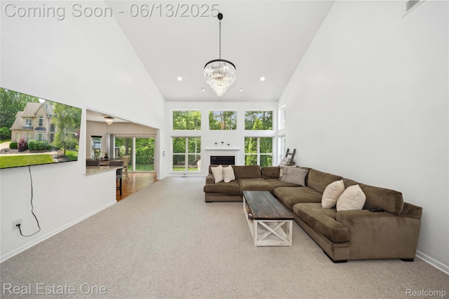 3788 High Grove Way, Lake Orion, MI 48360 - living room with high vaulted ceiling, carpet floors, baseboards, a chandelier, and a fireplace