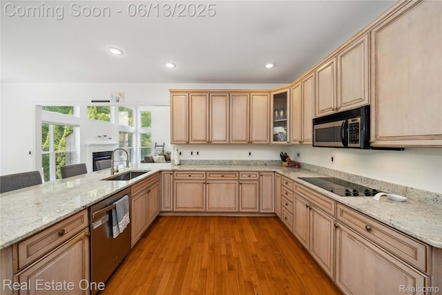 3788 High Grove Way, Lake Orion, MI 48360 - kitchen featuring stainless steel appliances, a sink, light brown cabinets, light wood-style floors, and light stone countertops