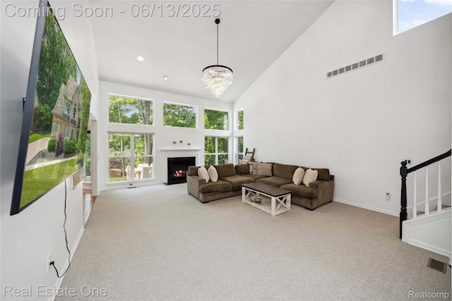 3788 High Grove Way, Lake Orion, MI 48360 - carpeted living room featuring high vaulted ceiling, a chandelier, stairs, baseboards, and a fireplace with flush hearth