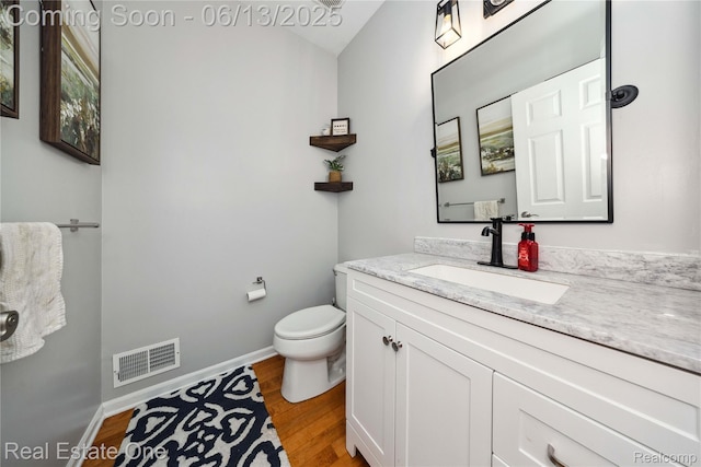 3788 High Grove Way, Lake Orion, MI 48360 - bathroom with wood finished floors, vanity, toilet, and baseboards