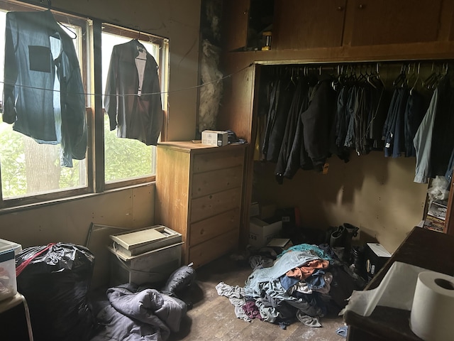 342 Grand St, Michigan Center, MI 49254 - bedroom featuring a closet and unfinished concrete flooring