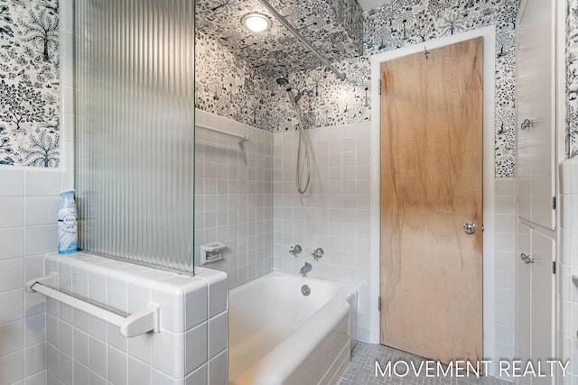 1001 Cricklewood St SW, Wyoming, MI 49509 - bathroom featuring tub / shower combination and tile patterned floors