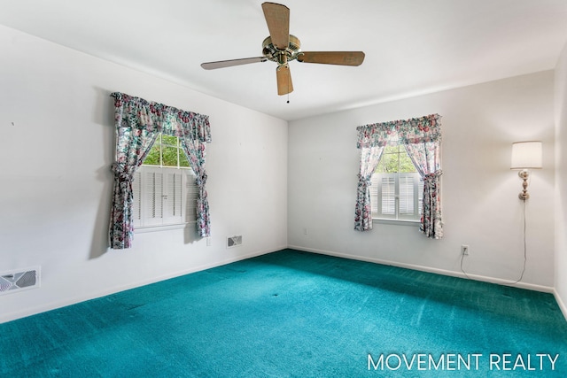 1001 Cricklewood St SW, Wyoming, MI 49509 - carpeted empty room with ceiling fan and baseboards