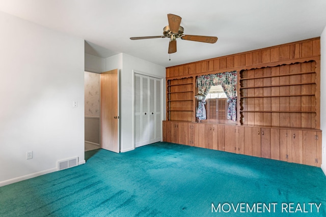 1001 Cricklewood St SW, Wyoming, MI 49509 - carpeted empty room with ceiling fan and baseboards