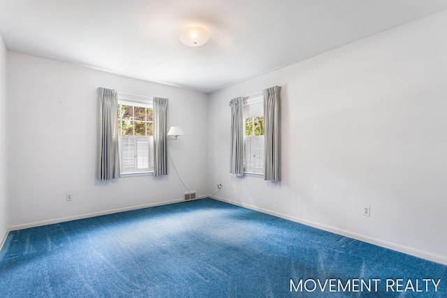 1001 Cricklewood St SW, Wyoming, MI 49509 - carpeted spare room with baseboards
